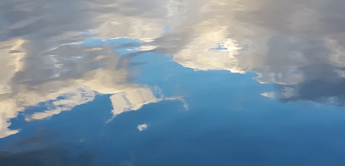 Reflection of clouds in the water at Hayden Lake