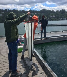 Image shows ISDA agent conducting survey for invasive mussels.